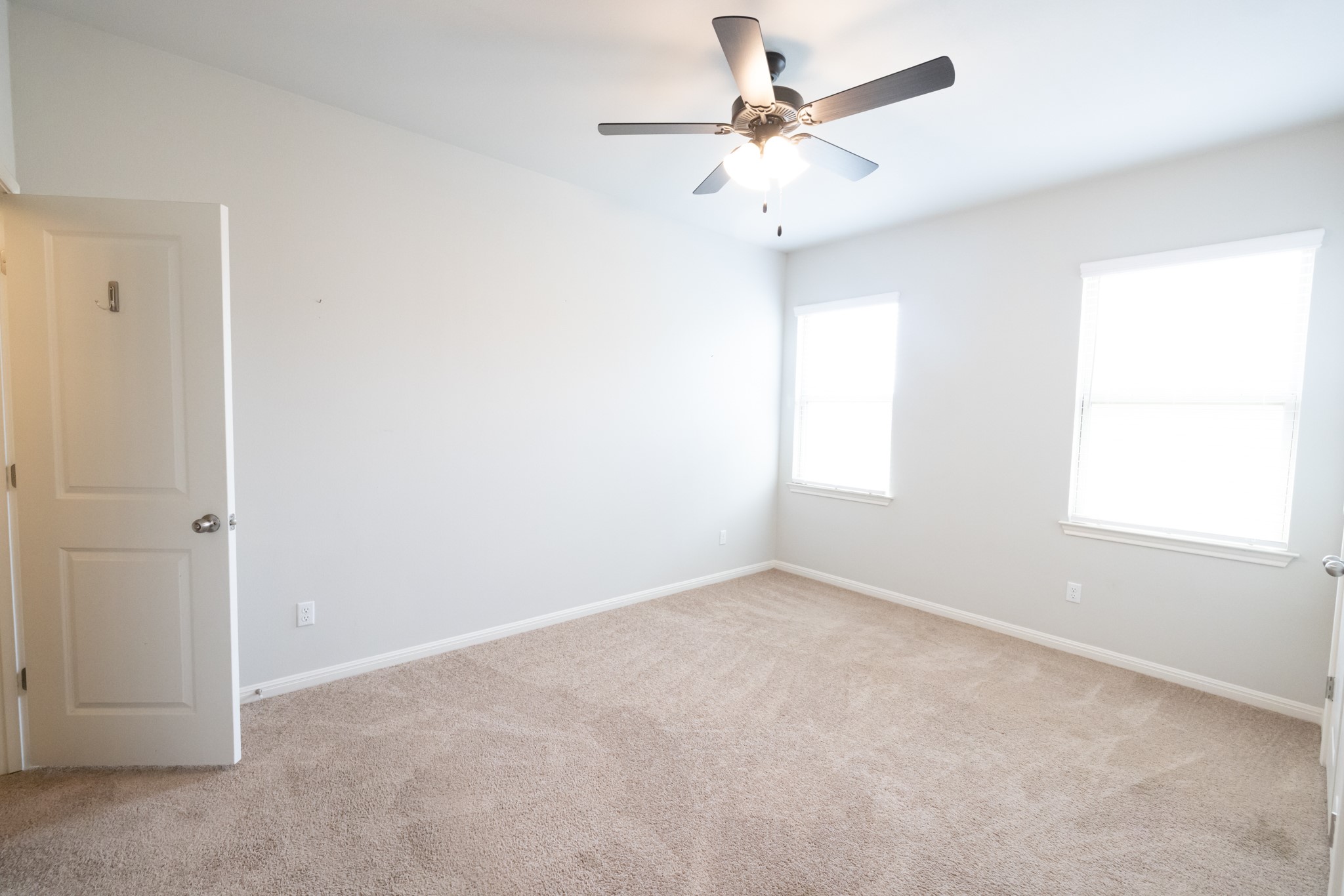 2809 Seneca Path, Unit 30 Leander, TX 78641 - Photo 18 of 30 an empty room with a window and a fan