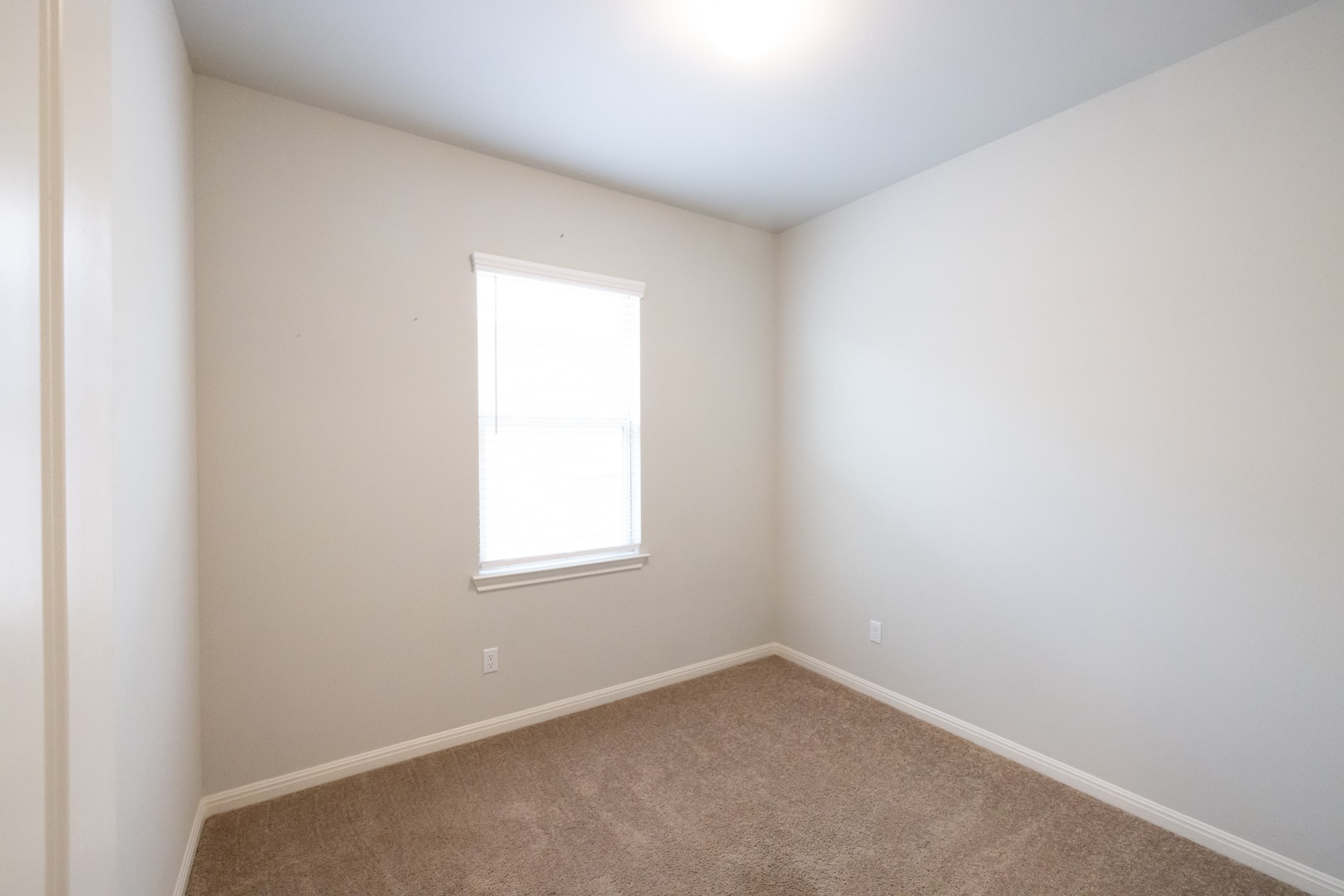 2809 Seneca Path, Unit 30 Leander, TX 78641 - Photo 19 of 30 an empty room with a window
