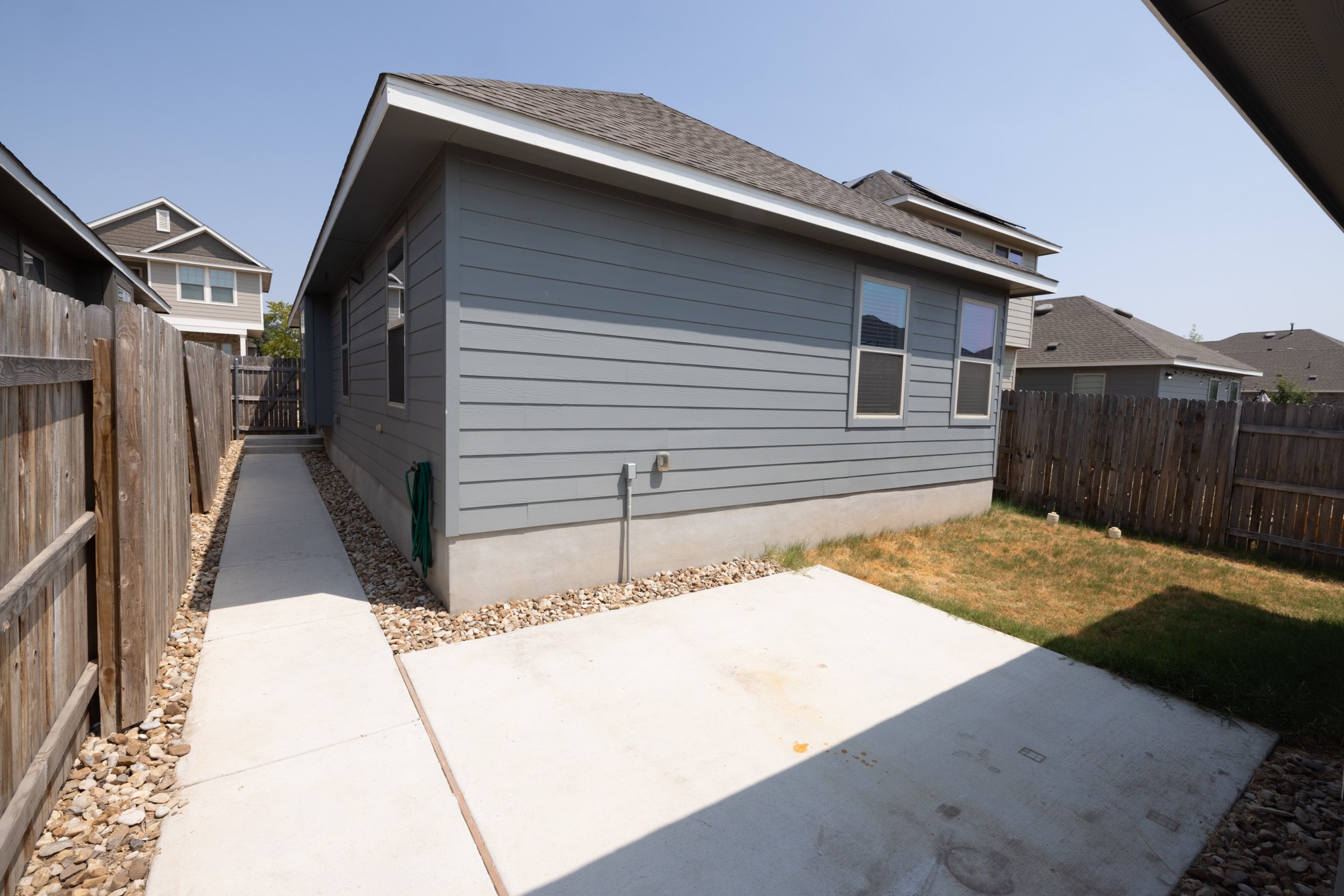 2809 Seneca Path, Unit 30 Leander, TX 78641 - Photo 28 of 30 a backyard of a house with wooden fence