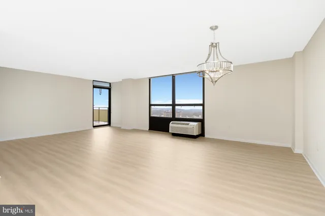a view of empty room with a fireplace