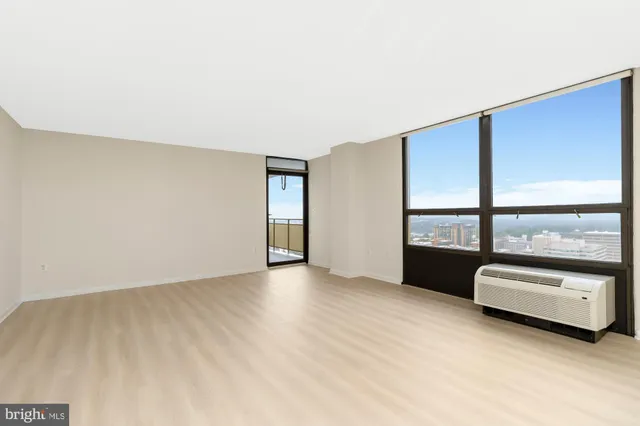 a view of an empty room with a window