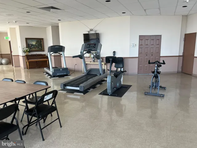 a work room with furniture and white walls