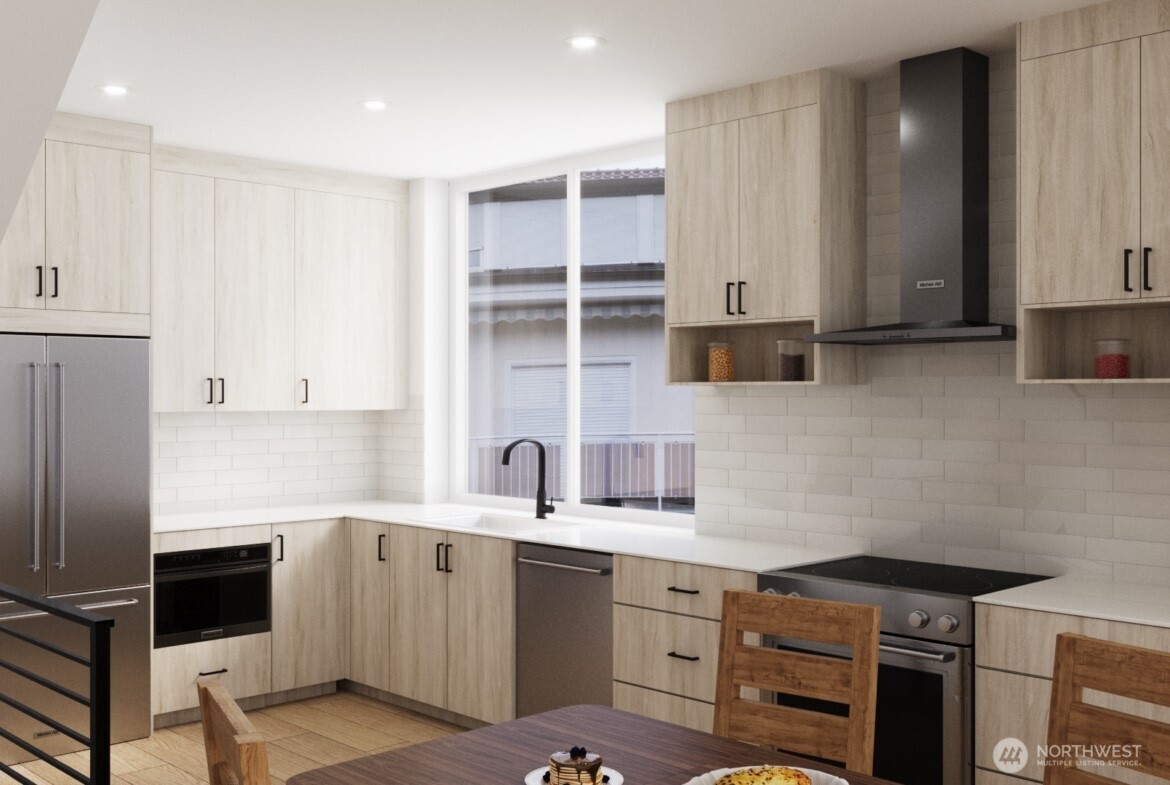 1014 Northeast 70th Street, Unit 1014B Seattle, WA 98115 - Photo 6 of 15 a kitchen with a sink cabinets and stainless steel appliances
