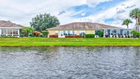 a view of a big house in a big yard with a house