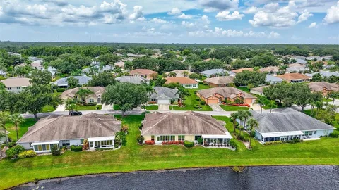 an aerial view of a house with garden space and street view