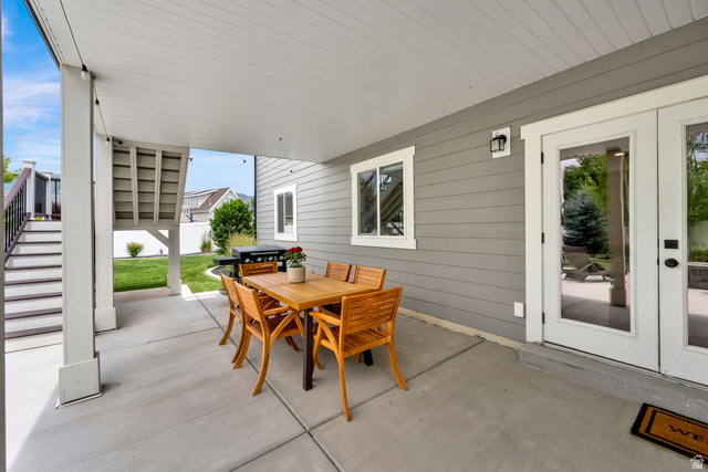 1132 South 1300th Street West Mapleton, UT 84664 - Photo 45 of 52 Covered concrete patio featuring shiplap ceiling, recessed lighting, and direct access through double glass panel doors