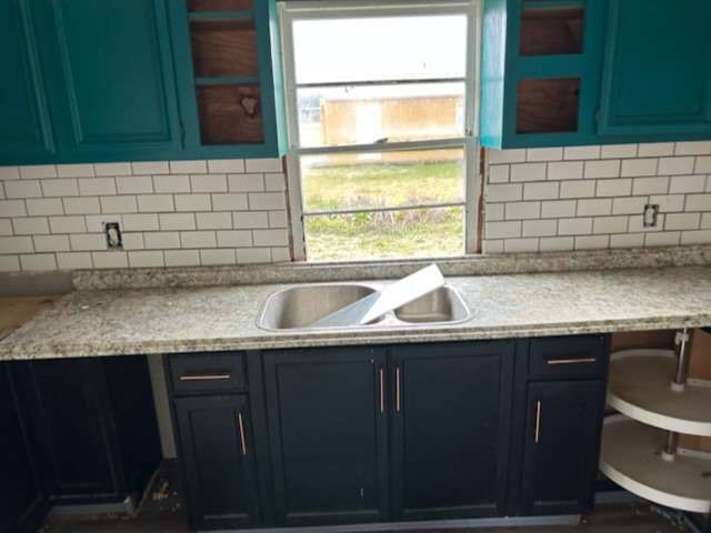 6708 Hawthorne Road Hitchcock, TX 77563 - Photo 6 of 9 a kitchen with granite countertop a sink and a window