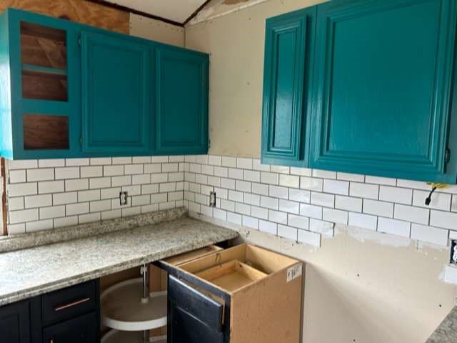 6708 Hawthorne Road Hitchcock, TX 77563 - Photo 7 of 9 a bathroom with a sink and cabinets