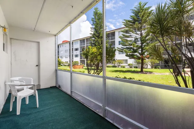 a view of balcony with a potted plant
