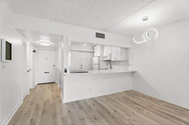a view of kitchen with wooden floor