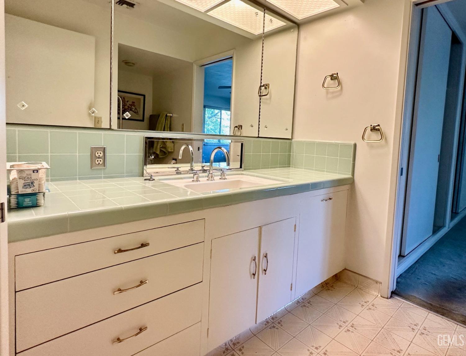 Undisclosed Address Bakersfield, CA 93306 - Photo 17 of 34 a bathroom with a sink and a mirror