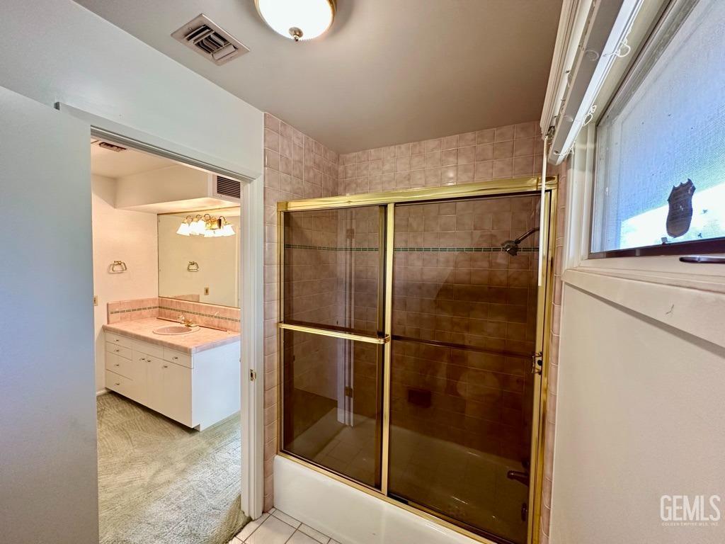 Undisclosed Address Bakersfield, CA 93306 - Photo 23 of 34 a bathroom with a shower and mirror