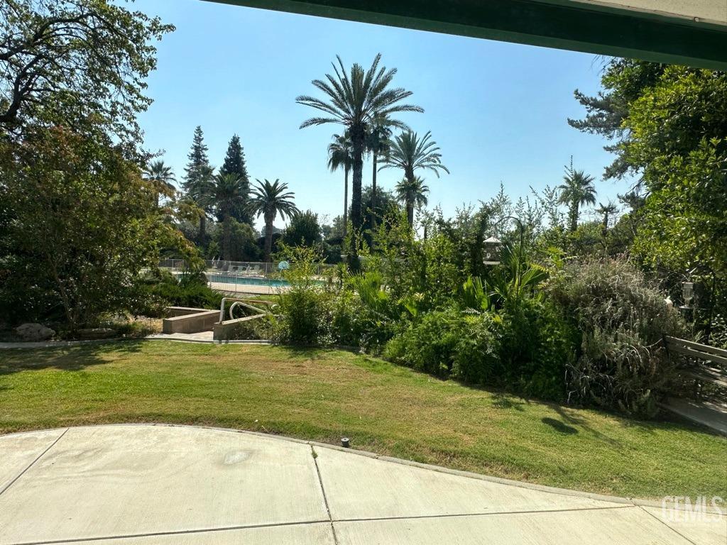 Undisclosed Address Bakersfield, CA 93306 - Photo 27 of 34 a view of a swimming pool with a yard
