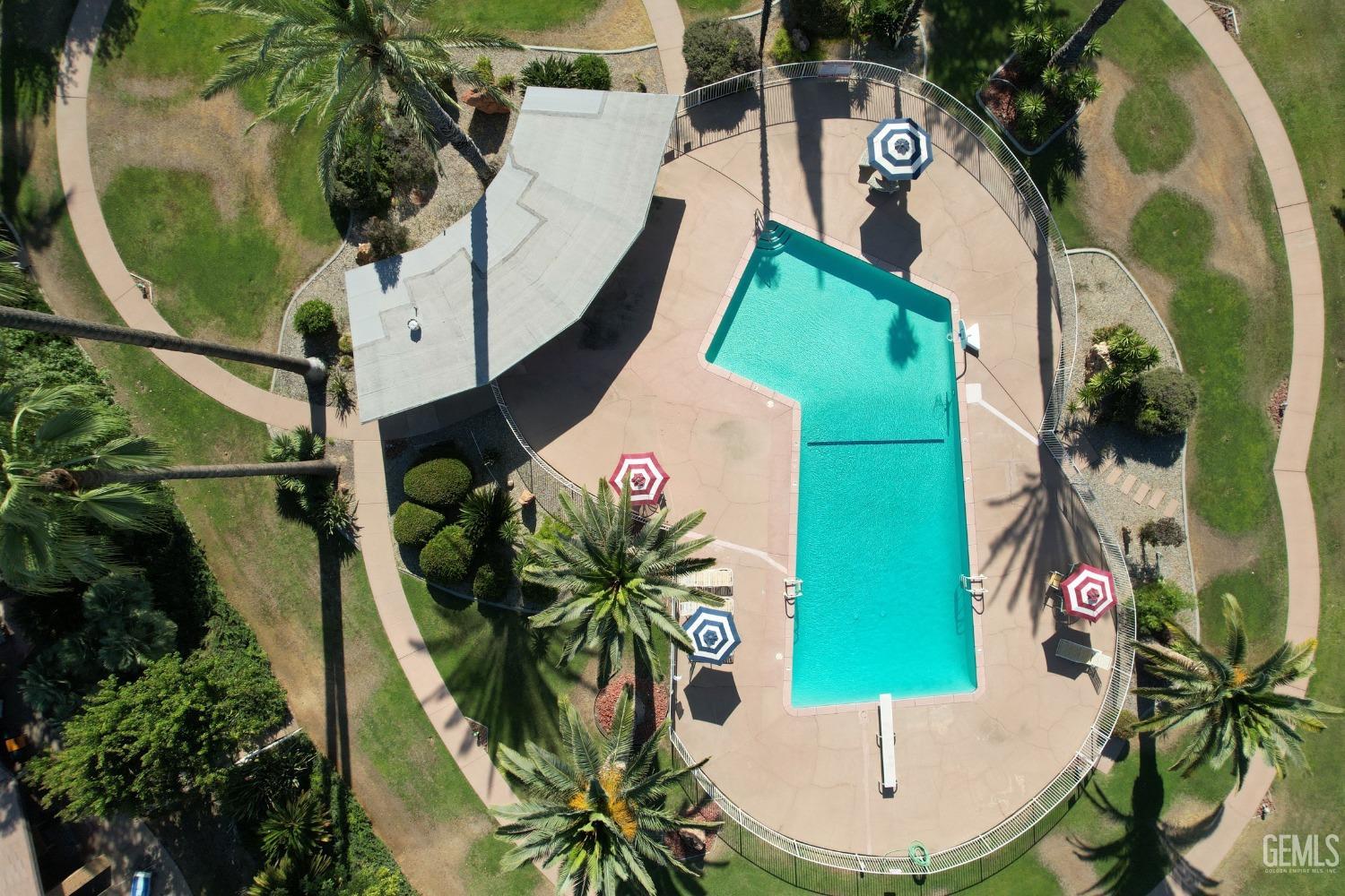 Undisclosed Address Bakersfield, CA 93306 - Photo 28 of 34 an aerial view of a swimming pool with outdoor seating and yard