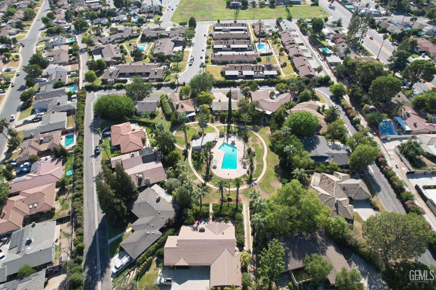 Undisclosed Address Bakersfield, CA 93306 - Photo 32 of 34 an aerial view of residential houses with outdoor space and parking
