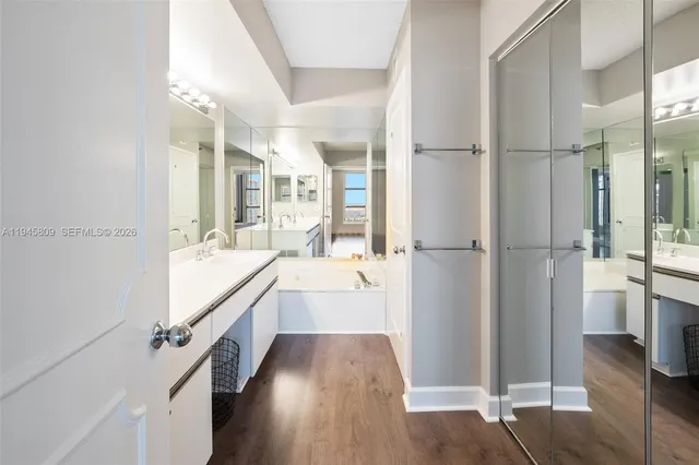 a bathroom with a sink double vanity and a mirror
