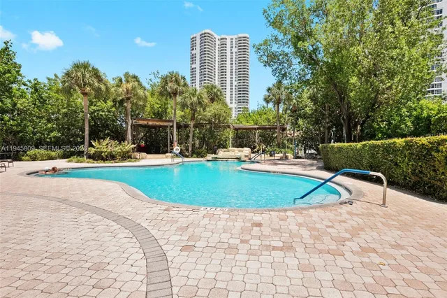 a view of swimming pool from a lounge chair