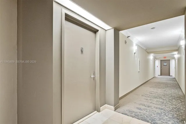 a kitchen with a refrigerator and cabinets