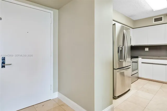a living room with furniture a large window and a flat screen tv