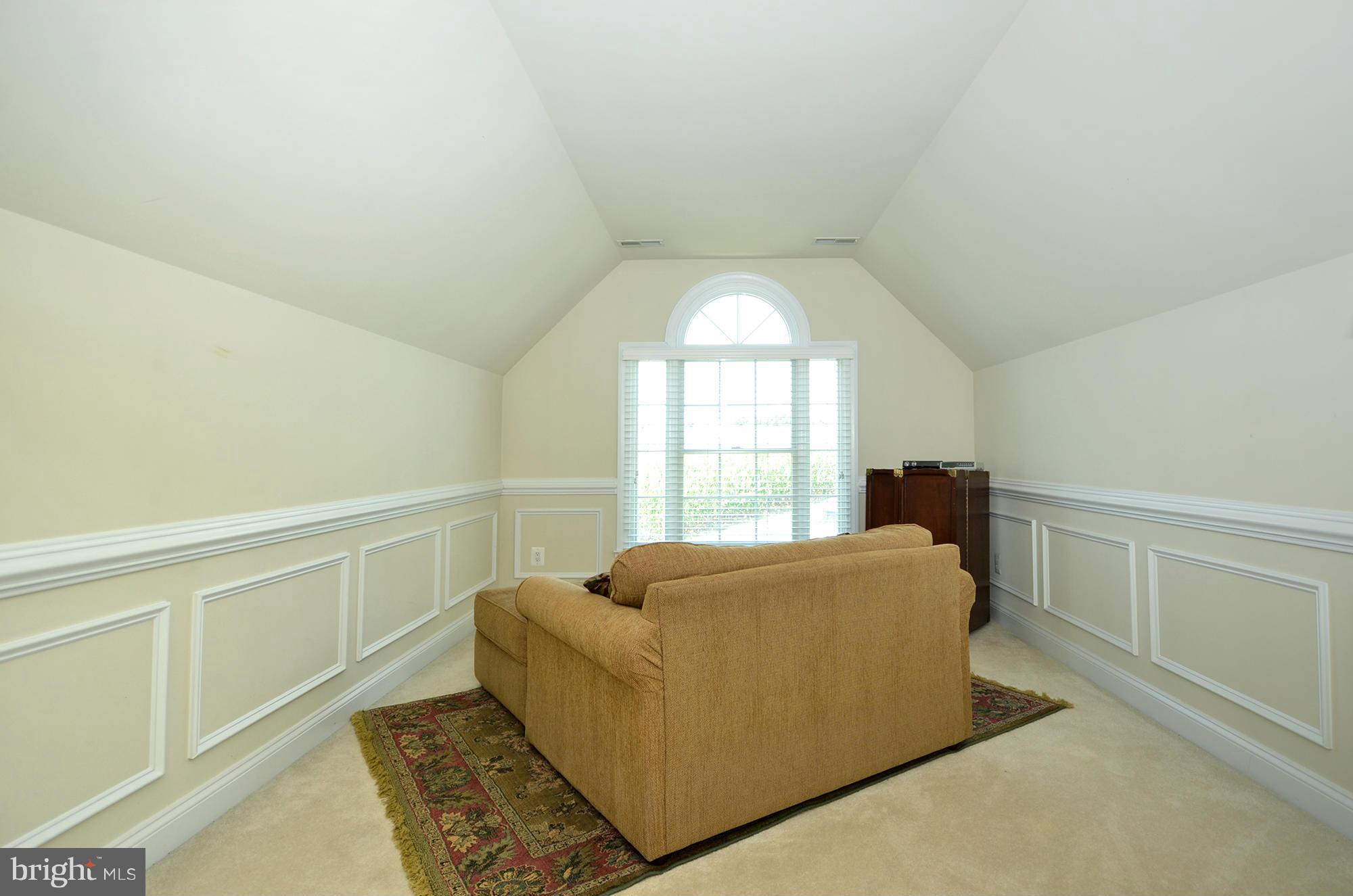 3401 Meredith Ridge Road Phoenix, MD 21131 - Photo 14 of 28 a living room with a couch and a table