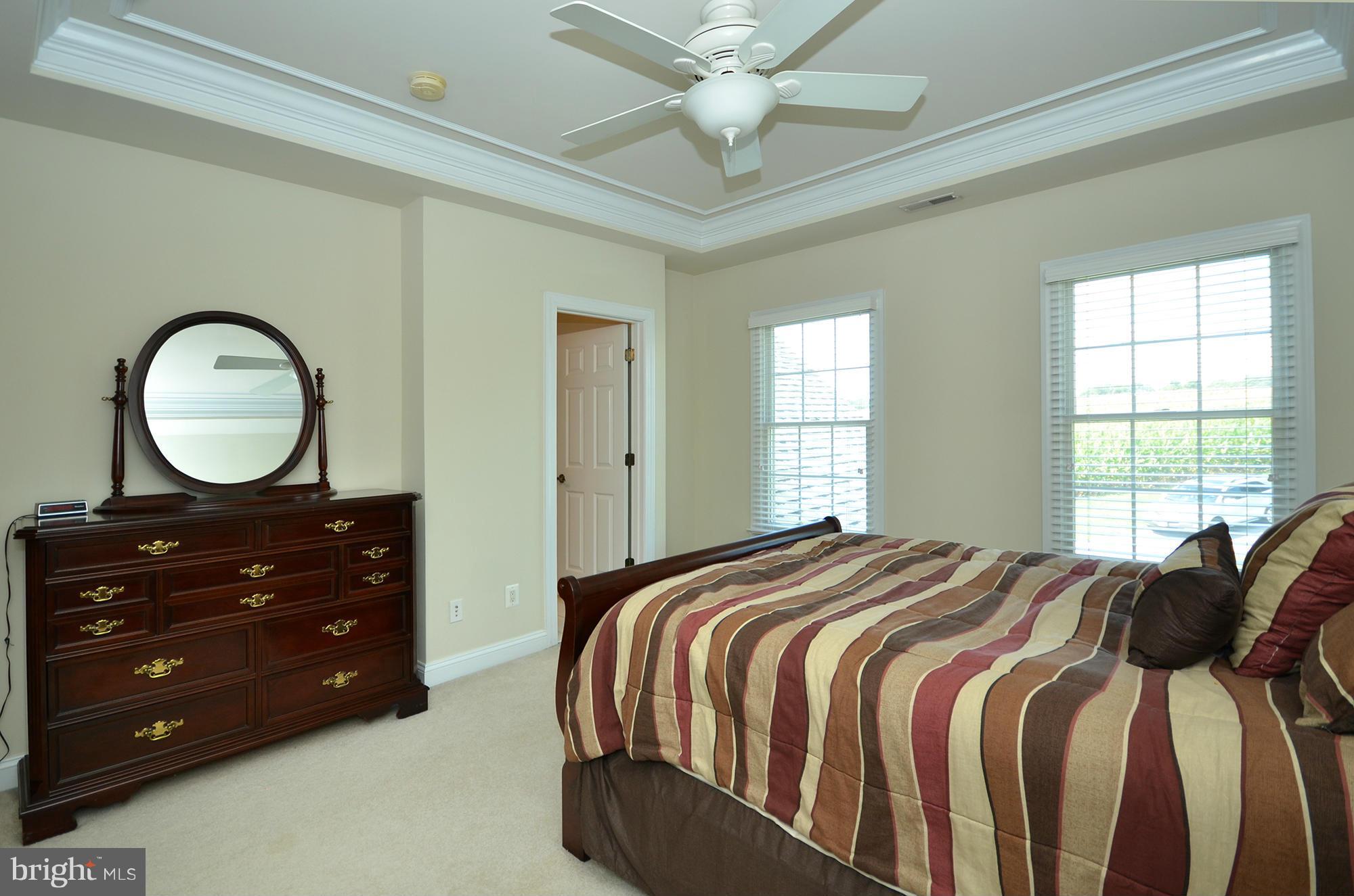 3401 Meredith Ridge Road Phoenix, MD 21131 - Photo 19 of 28 a bedroom with a bed and a dresser