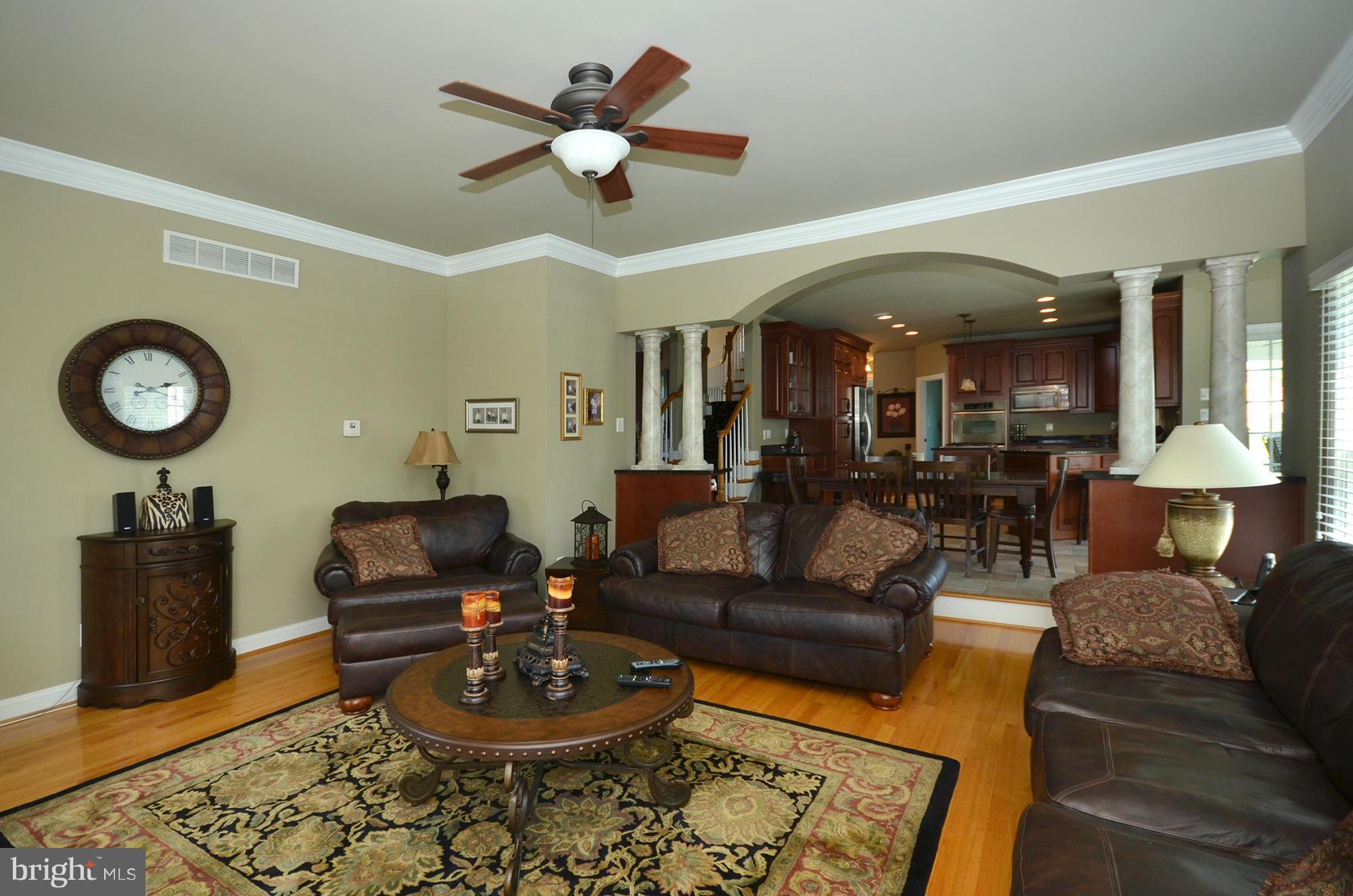 3401 Meredith Ridge Road Phoenix, MD 21131 - Photo 9 of 28 a living room with furniture a clock and a rug