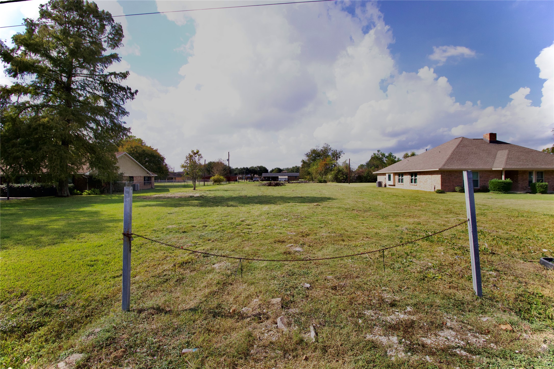 10307 Sralla Road Crosby, TX 77532 - Photo 3 of 5 a view of a street with a big yard