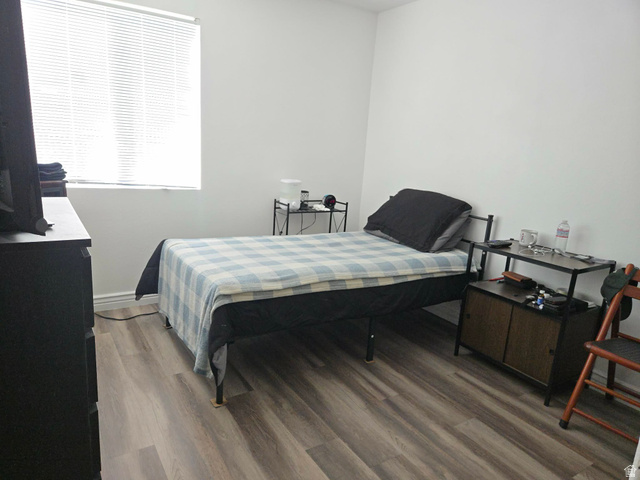 90 East Resaca Drive, Unit C11 Sandy, UT 84070 - Photo 13 of 27 Bedroom with light wood-style flooring and baseboards