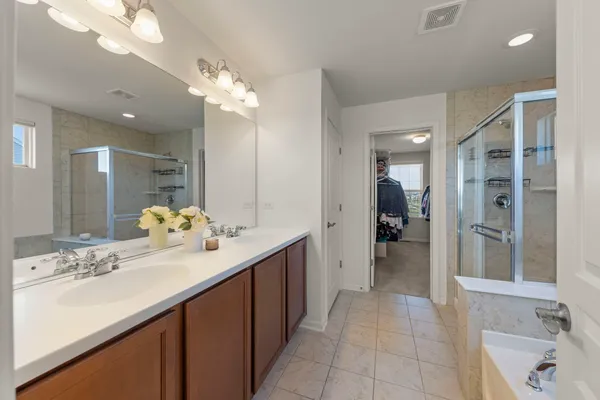 a bathroom with a tub and a view of bathroom