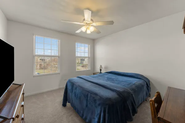 a bed room with a bed and a window