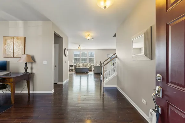 a view of entryway with livingroom and wooden floor