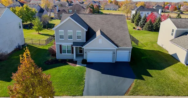 an aerial view of a house having yard