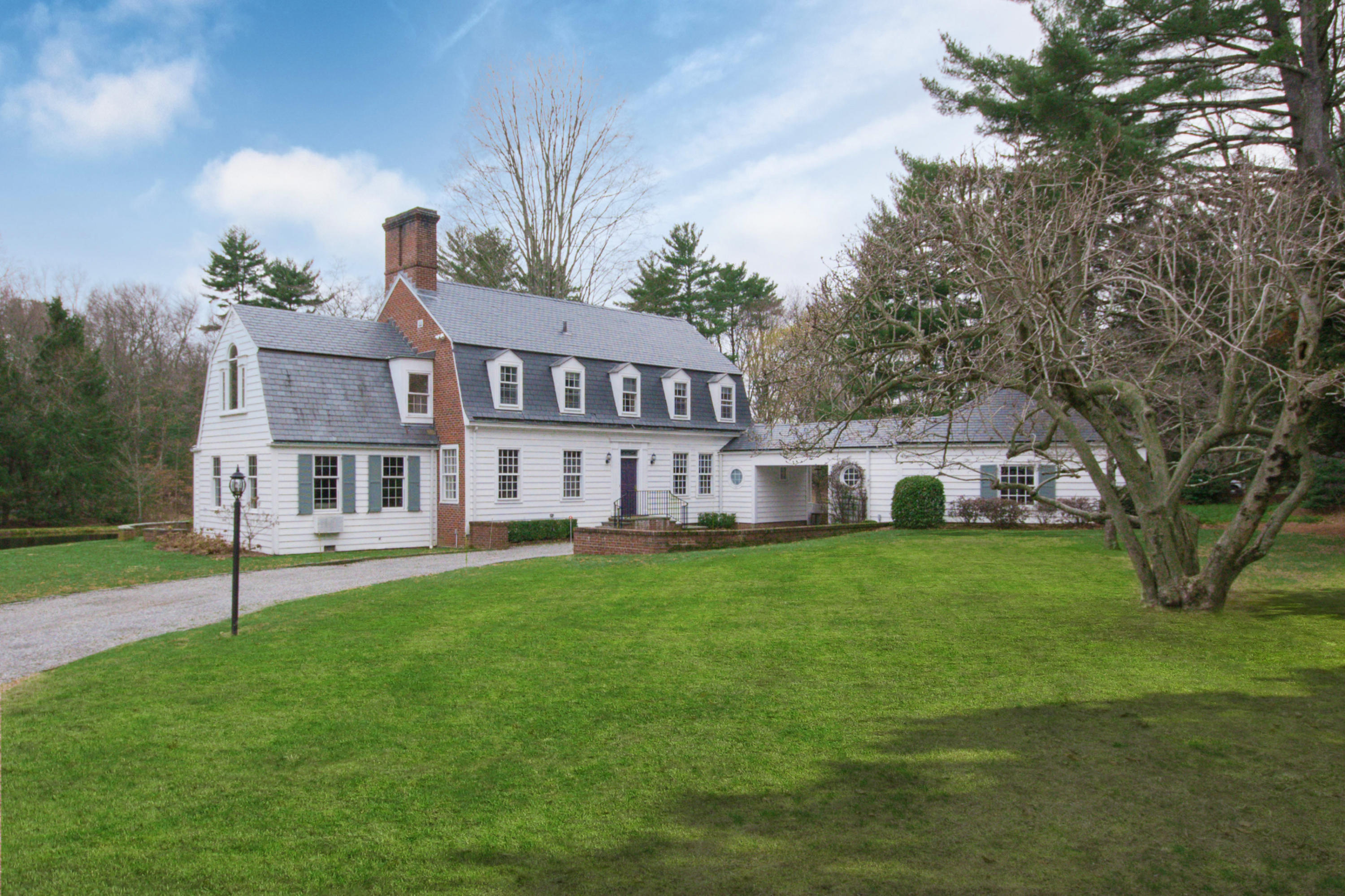 95 Half Mile Road Darien, CT 06820 - Photo 1 of 36 a front view of house with yard and green space