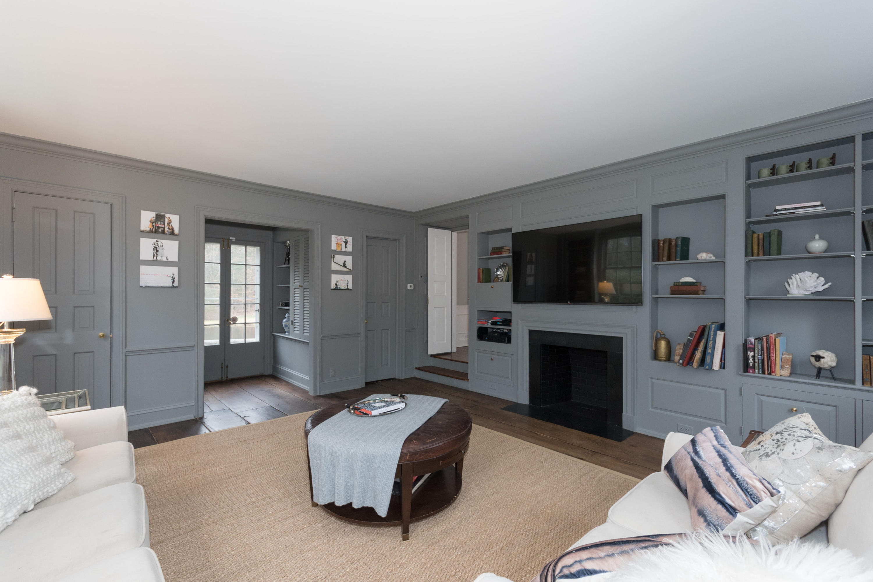95 Half Mile Road Darien, CT 06820 - Photo 18 of 36 a living room with furniture and a flat screen tv