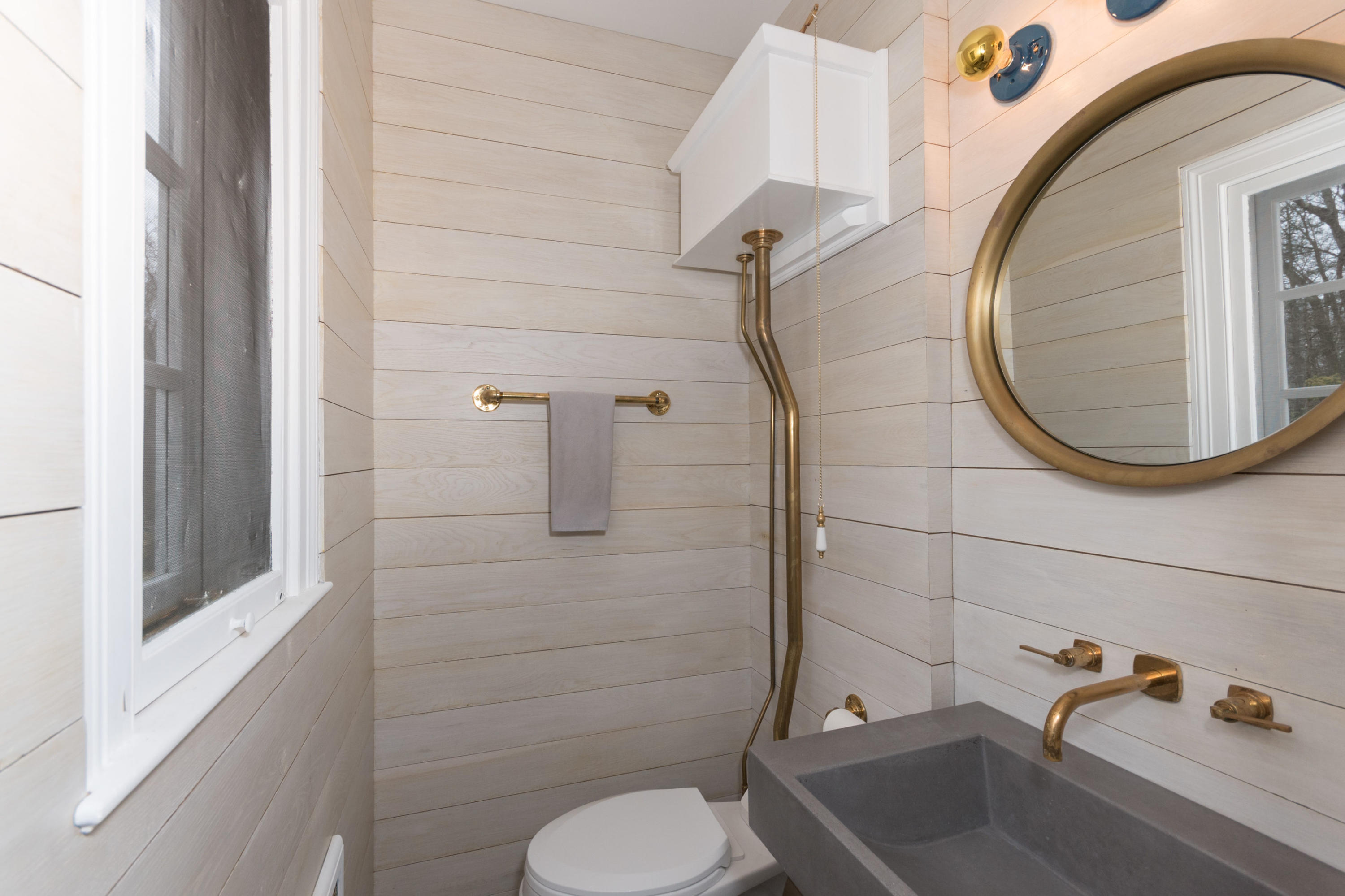 95 Half Mile Road Darien, CT 06820 - Photo 21 of 36 a bathroom with a sink and a mirror