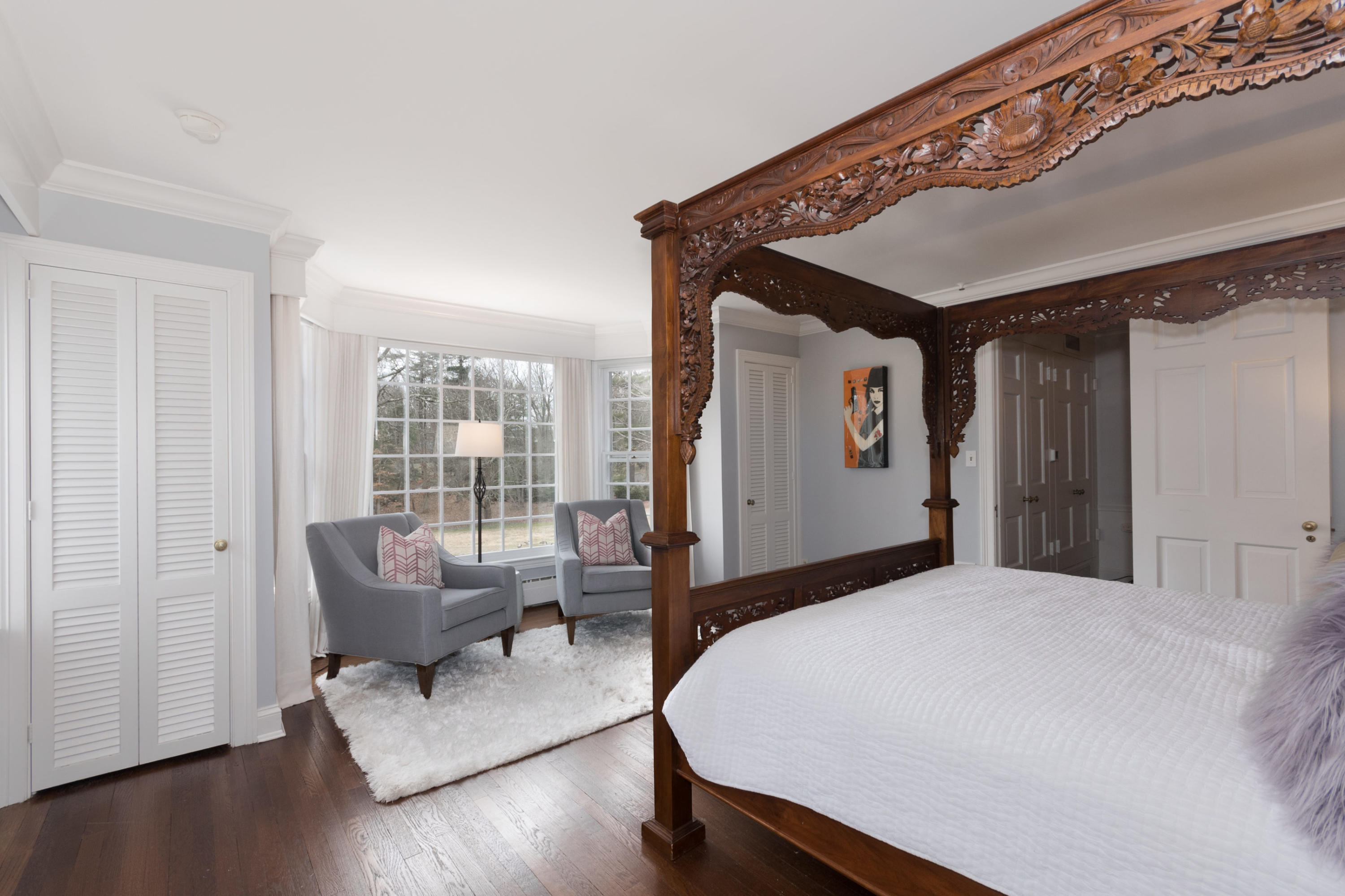 95 Half Mile Road Darien, CT 06820 - Photo 25 of 36 a bedroom with a bed and wooden floor