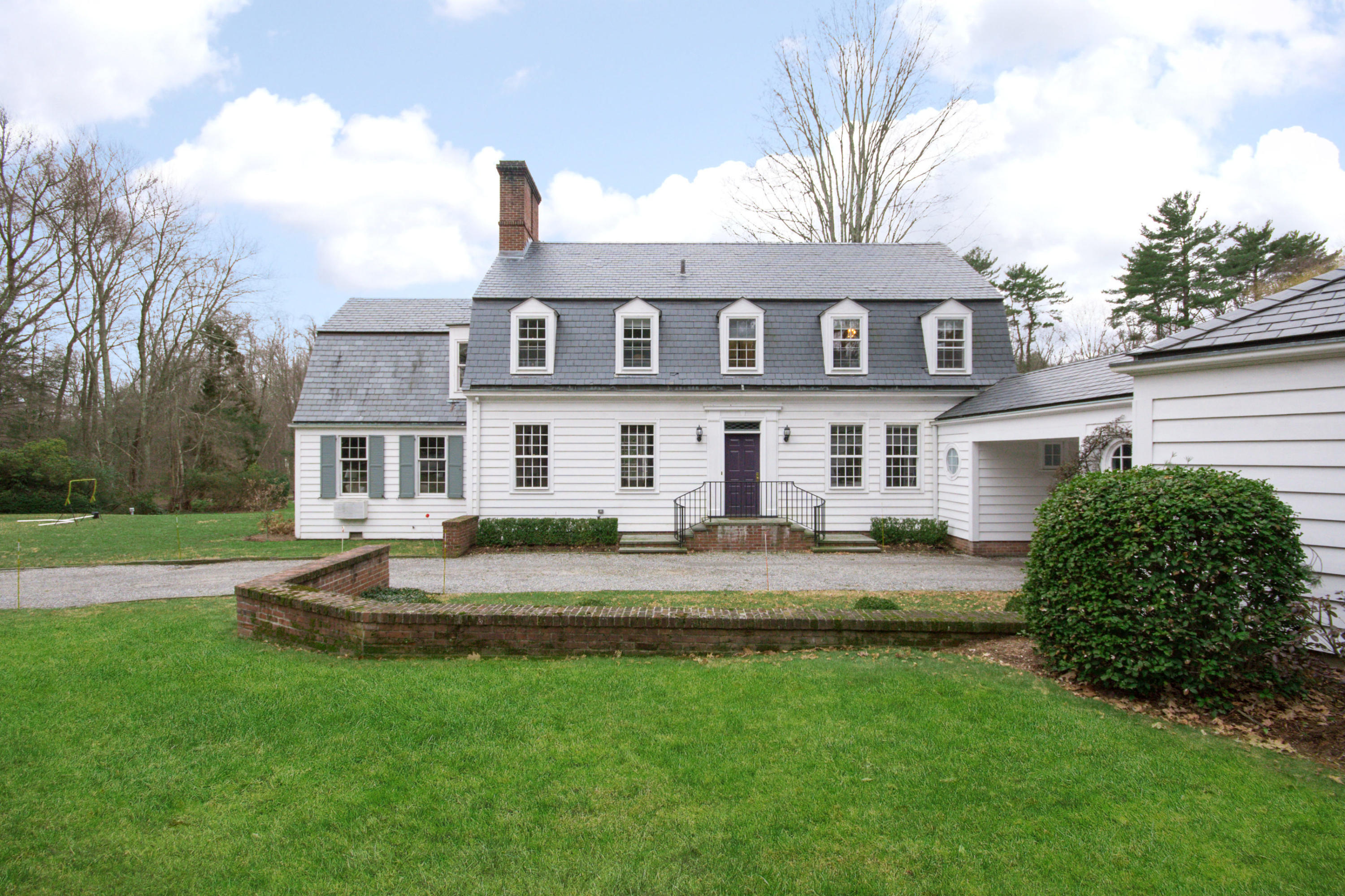 95 Half Mile Road Darien, CT 06820 - Photo 3 of 36 a front view of a house with a yard