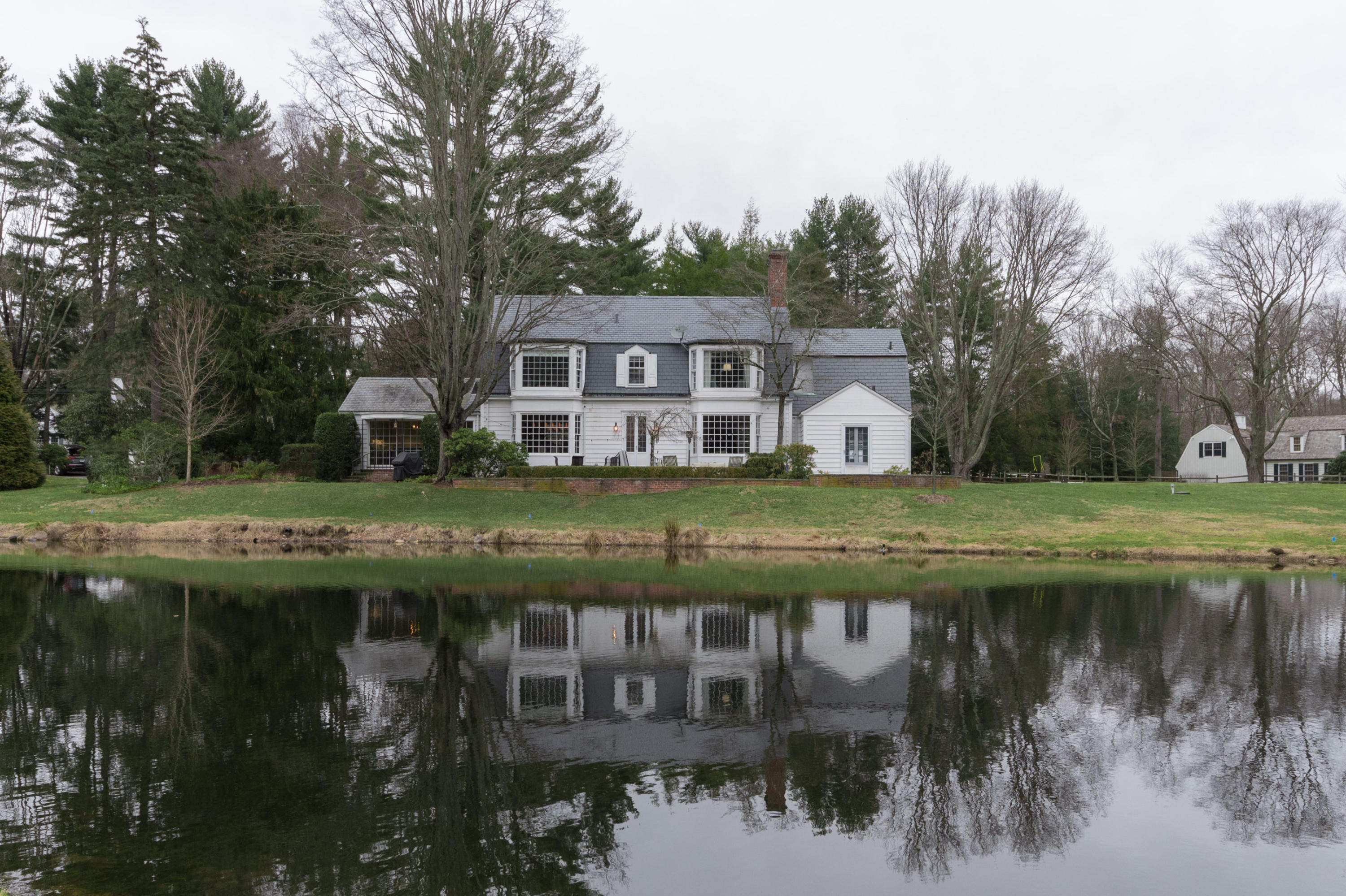95 Half Mile Road Darien, CT 06820 - Photo 32 of 36 a view of house with a yard from a lake view