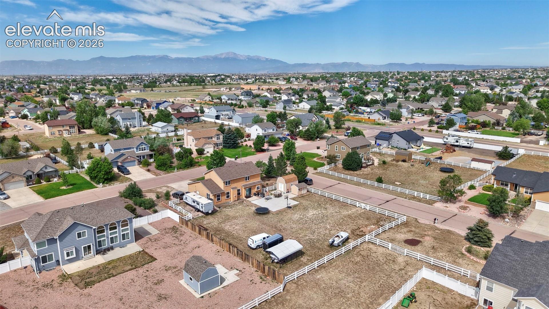 8347 Tibbs Road Peyton, CO 80831 - Photo 29 of 38 Expansive residential neighborhood with distant mountain ranges