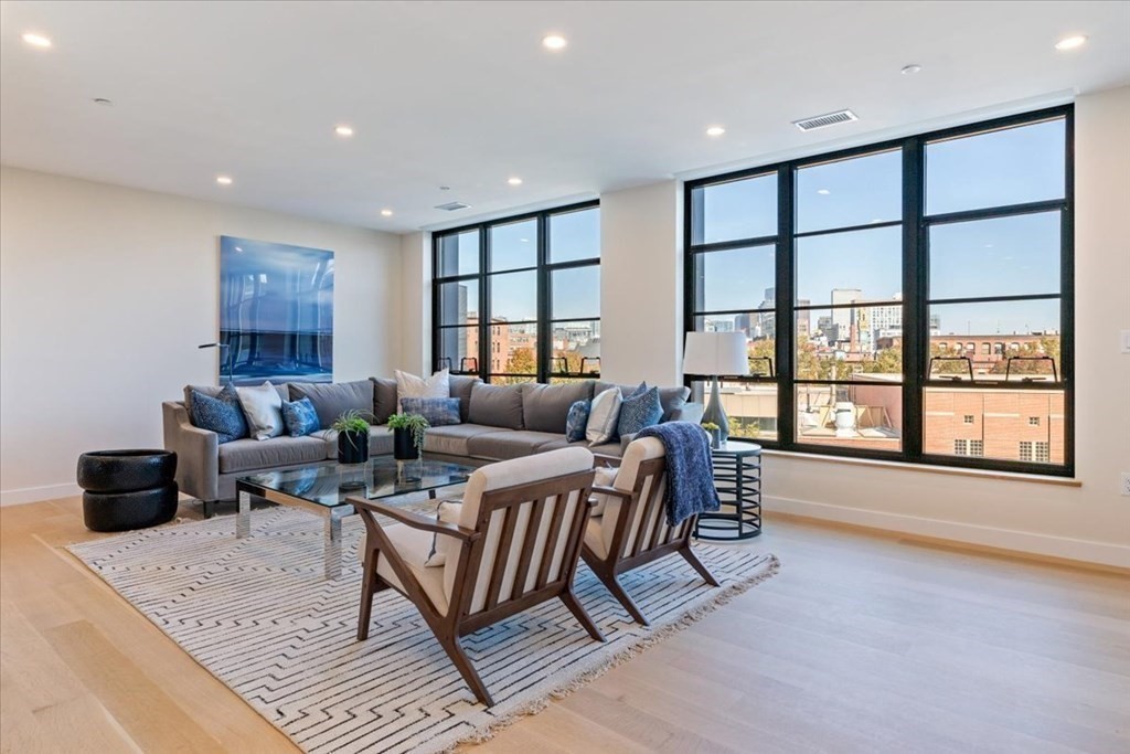 76 Wareham Street, Unit 5C Boston, MA 02118 - Photo 11 of 29 a living room with furniture and a large window