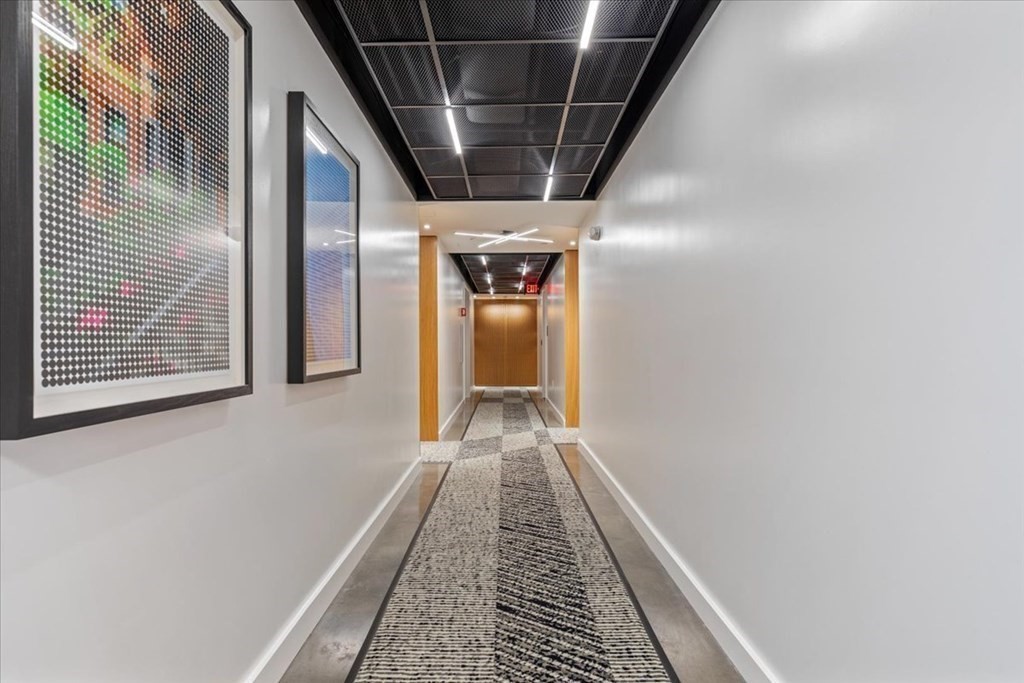 76 Wareham Street, Unit 5C Boston, MA 02118 - Photo 15 of 29 a view of a hallway with wooden floor