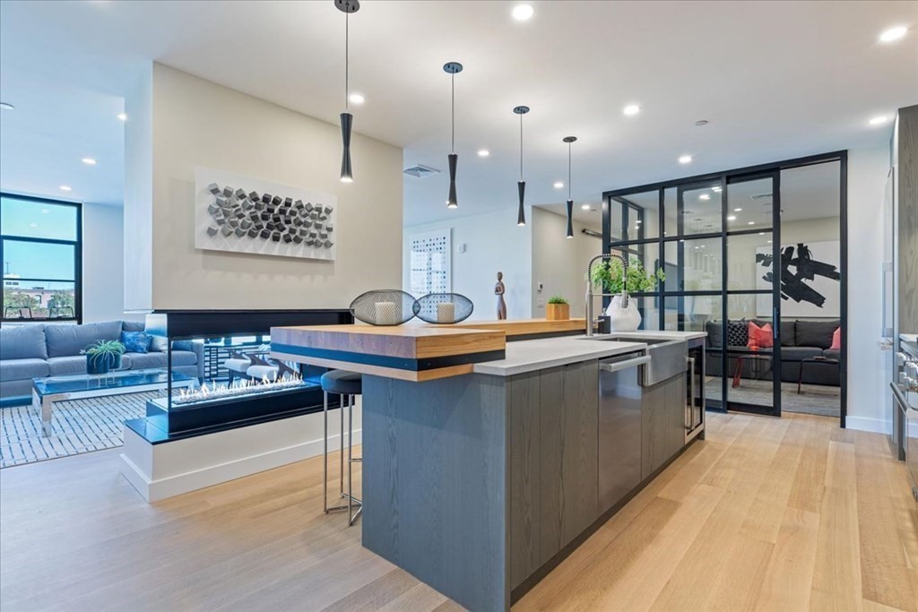 76 Wareham Street, Unit 5C Boston, MA 02118 - Photo 2 of 29 a kitchen with a sink stove and cabinets