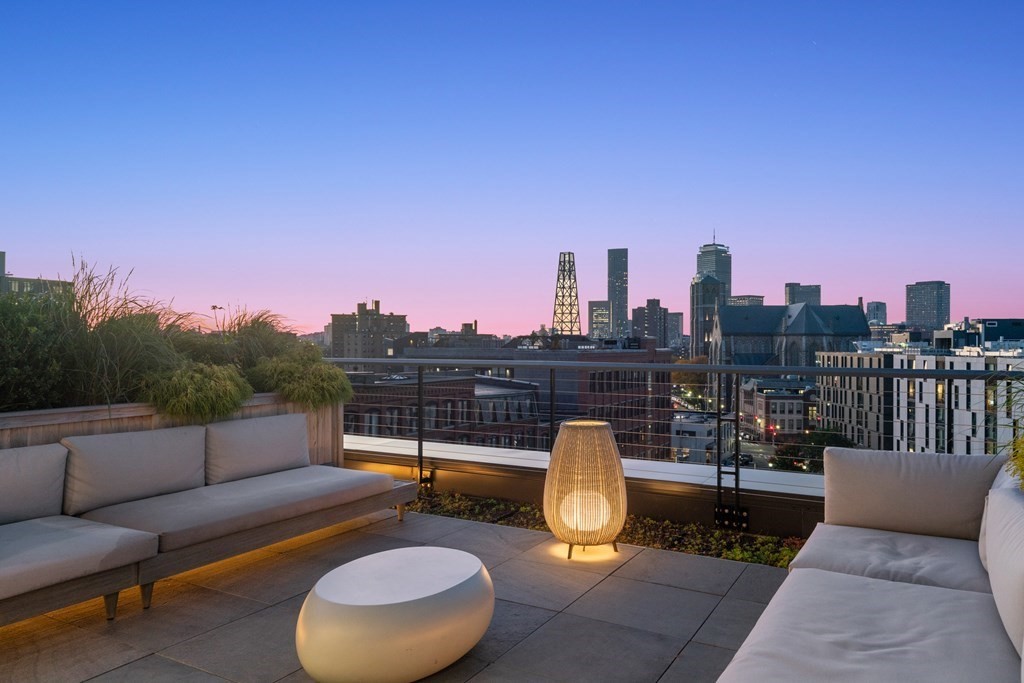 76 Wareham Street, Unit 5C Boston, MA 02118 - Photo 27 of 29 a view of a roof deck with couches and sky view