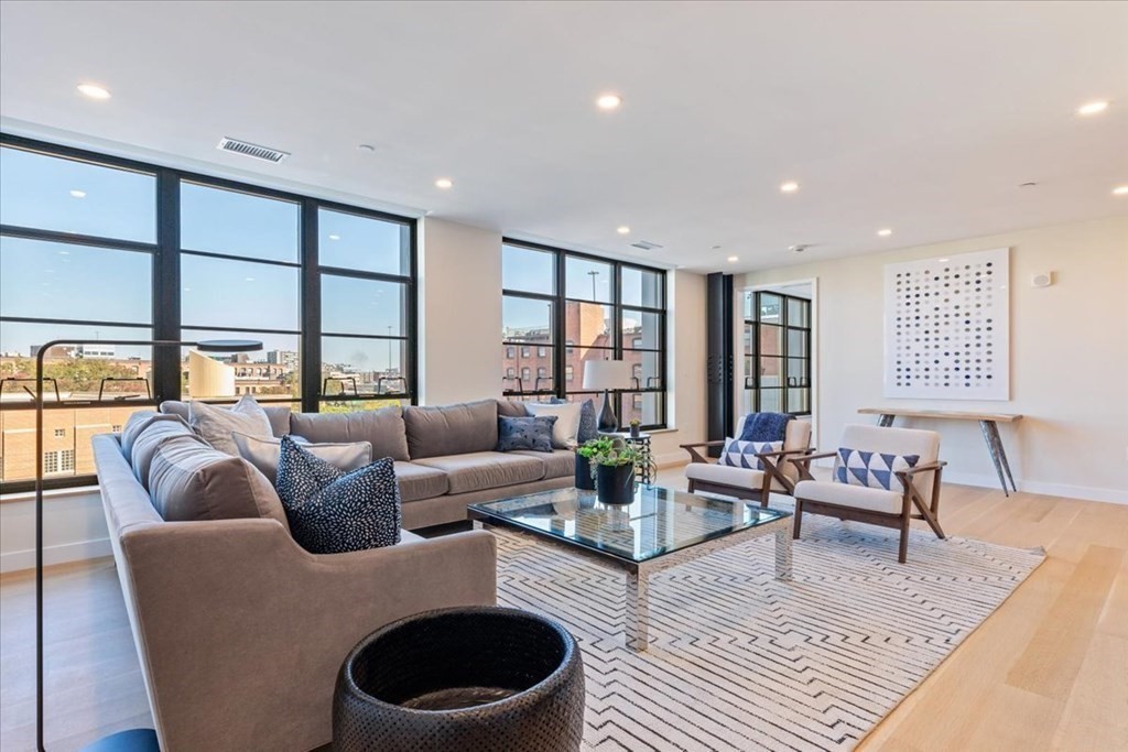 76 Wareham Street, Unit 5C Boston, MA 02118 - Photo 10 of 29 a living room with furniture and a large window