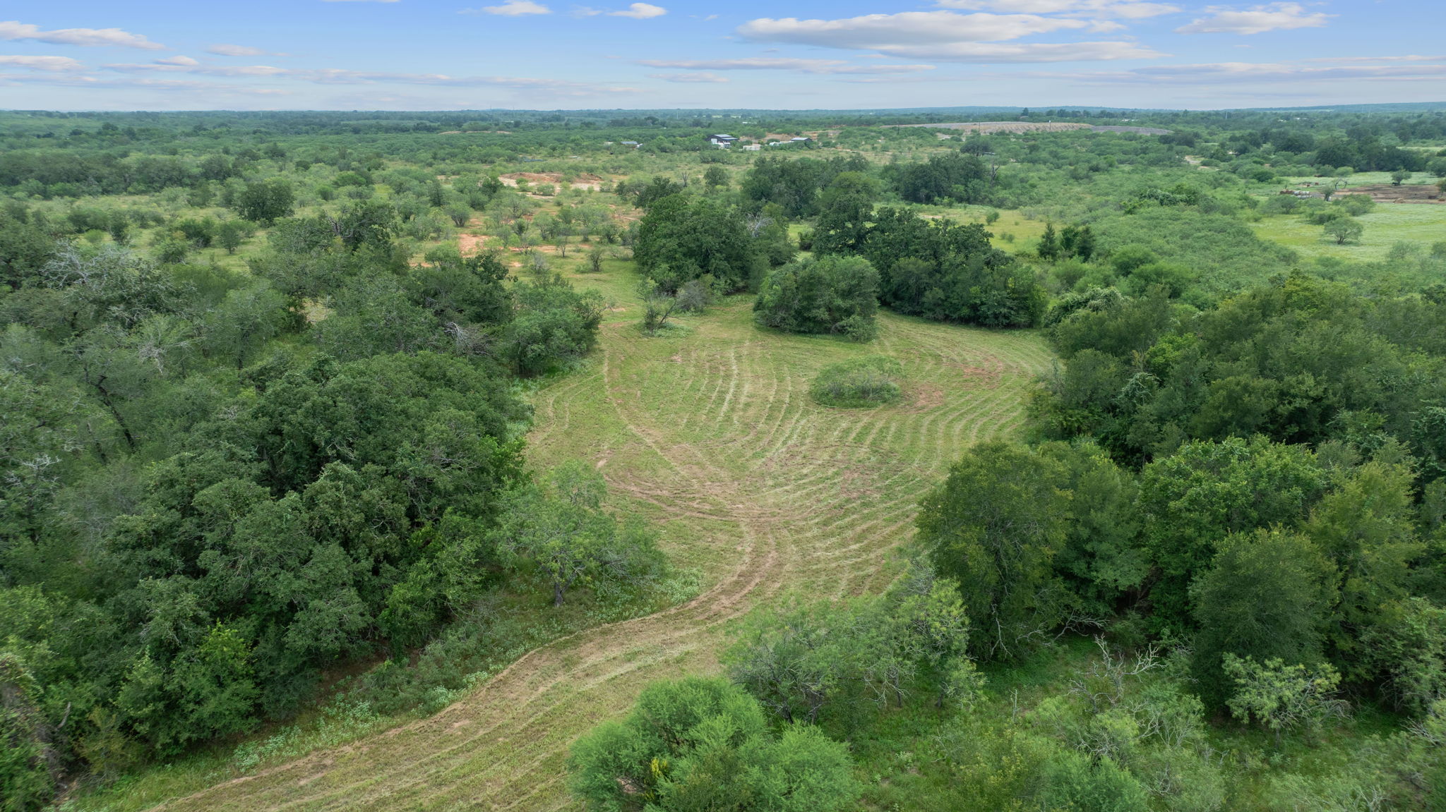 3597 Baker Road Kingsbury, TX 78638 - Photo 13 of 39 a view of a lush green outdoor space with a lake view