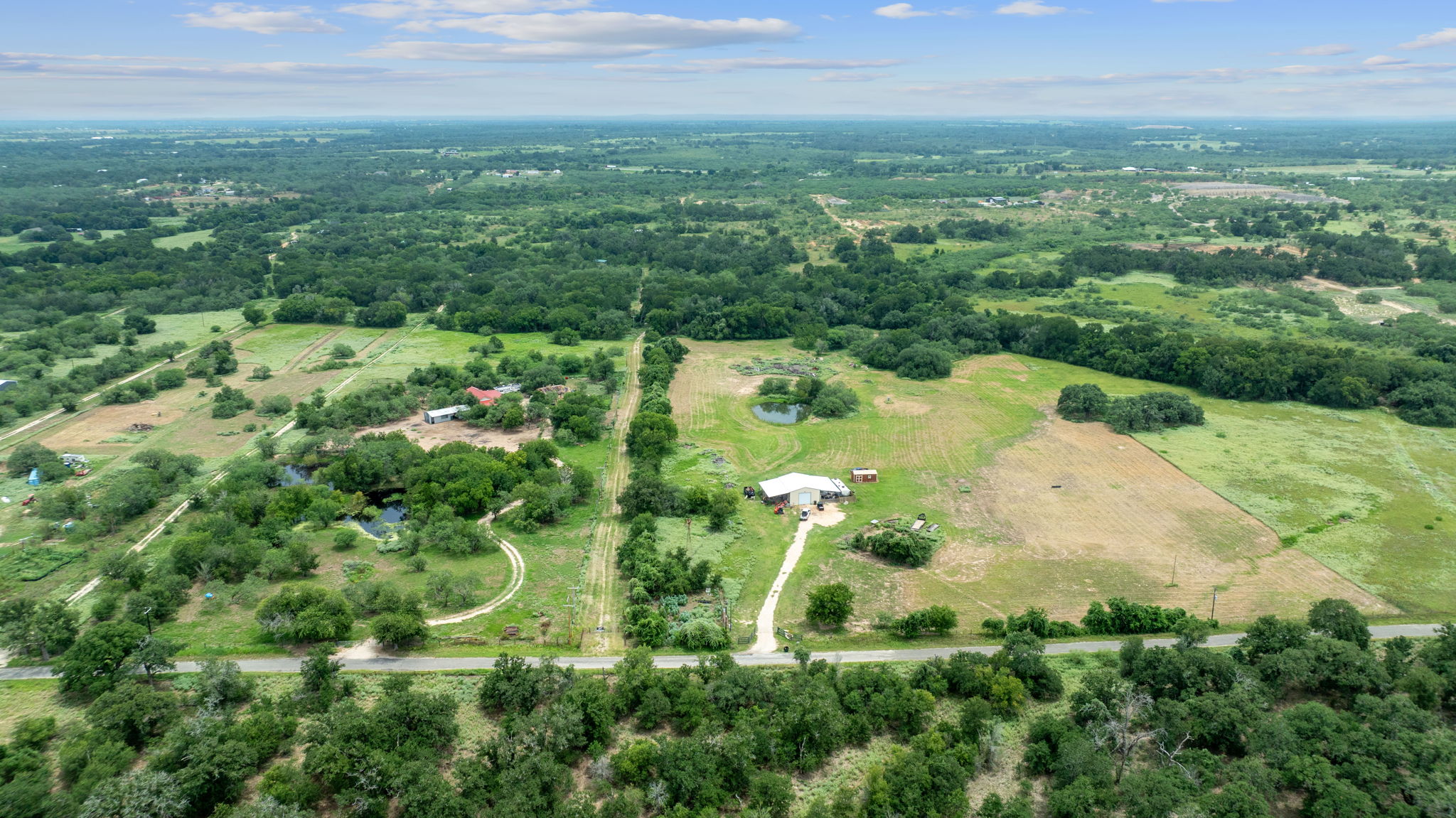 3597 Baker Road Kingsbury, TX 78638 - Photo 16 of 39 an aerial view of residential houses with outdoor space and trees all around