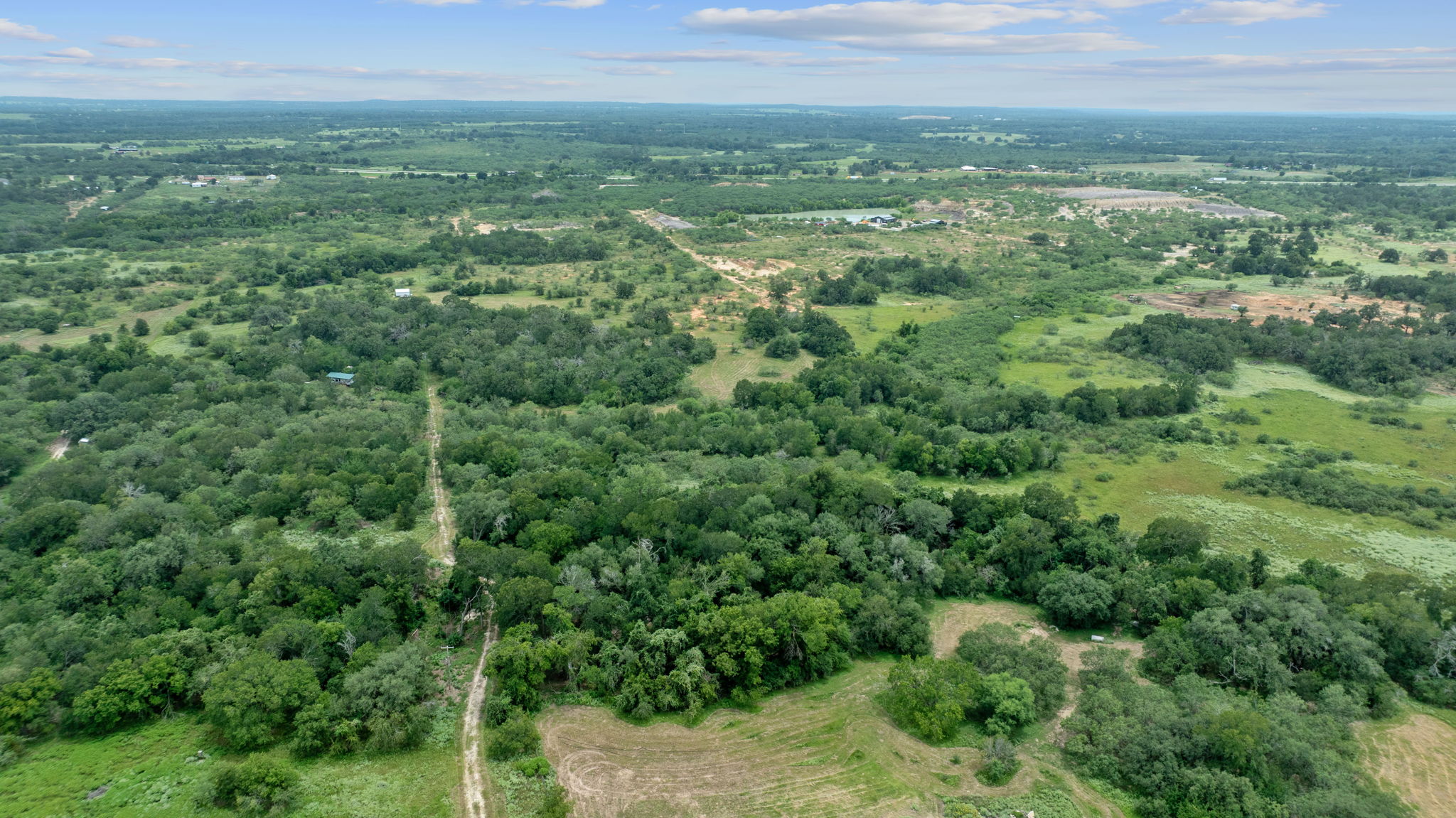 3597 Baker Road Kingsbury, TX 78638 - Photo 17 of 39 a view of a green field with lots of bushes
