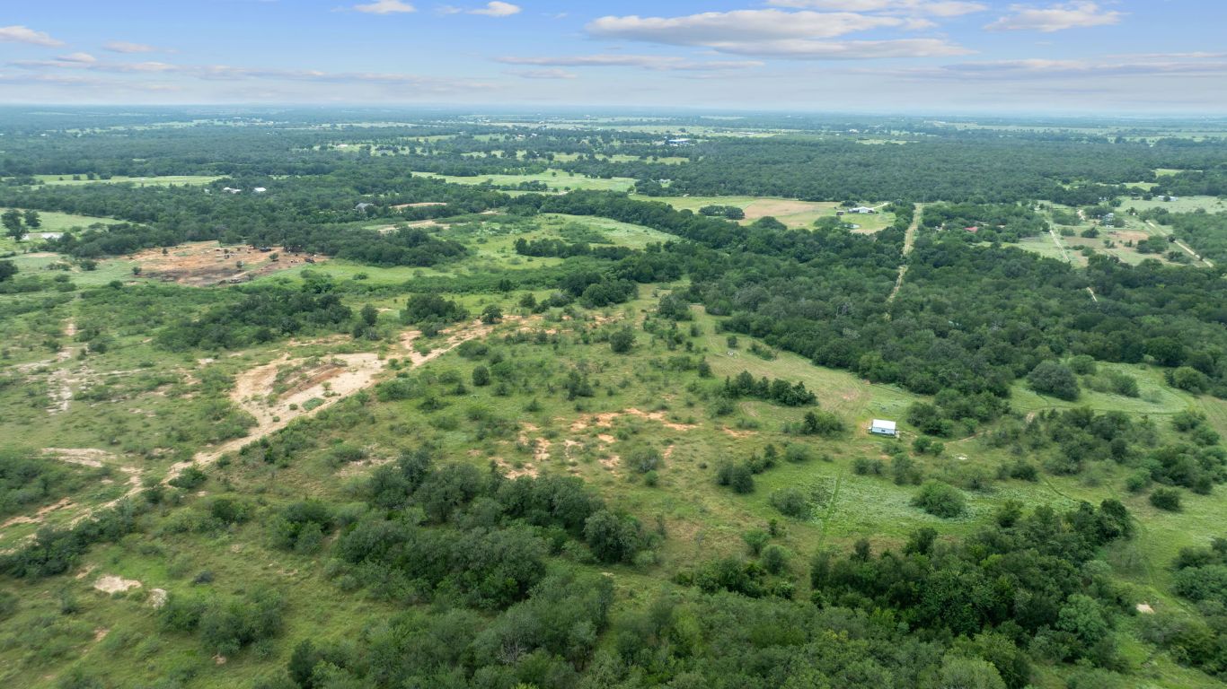 3597 Baker Road Kingsbury, TX 78638 - Photo 5 of 39 an aerial view of residential houses with outdoor space and trees