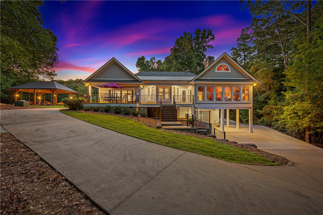 285 Bertha Allen Road Westminster, SC 29693 - Photo 44 of 50 A striking contemporary home features a broad driveway leading to a welcoming patio and a separate outdoor living area.