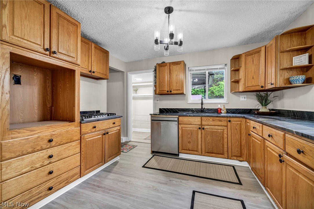 1603 Winchester Road Lyndhurst, OH 44124 - Photo 15 of 34 Updated kitchen with refreshed finishes, ample cabinet space, and a clean modern feel that makes everyday living and entertaining easy.
